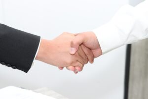 business merger handshake