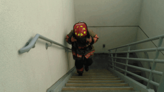 Firefighter climbing stairs